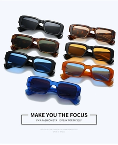 Flat lay of retro square rivet sunglasses in seven vibrant colors on a white background