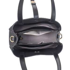 Detail view of black tote bag interior featuring three compartments and gold hardware