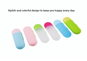 Group display of colorful capsule-shaped portable toothbrush holders in various pastel shades