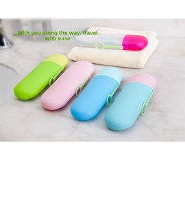 Detail view of capsule-shaped travel toothbrush case with portable hanging strap
