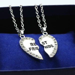 Silver split heart Best Friends necklace with rhinestones in a blue velvet box