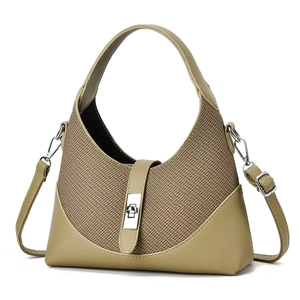 Detail of khaki green hobo bag featuring woven texture and silver metal lock closure
