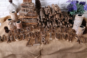 Close-up of vintage rustic wooden letters and numbers with natural tree bark texture