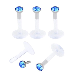Macro view of blue rhinestone labret studs with transparent acrylic flat back base set