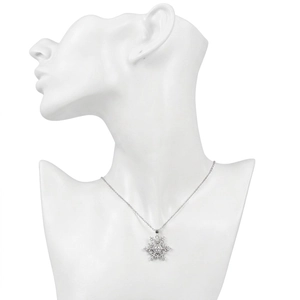 Elegant snowflake pendant necklace with cubic zirconia on black mannequin display
