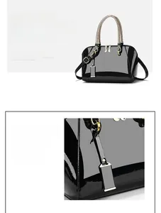 Detail of glossy patent leather shell bag with braided handles and golden hardware