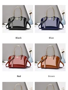 Detail view of glossy shell-shaped handbags in four vibrant colors with gold handles