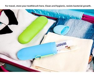 Portable candy-colored travel toothbrush cases in green and blue stored in a suitcase