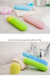 Vertical view of candy-colored portable travel toothbrush holders in a bathroom setting