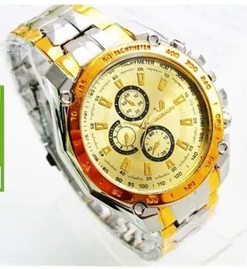 Detailed close-up of two-tone stainless steel watch band and gold chronograph dial