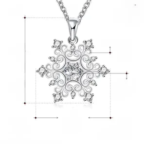 Close-up of snowflake pendant with zircon stones and silver-plated hollow pattern