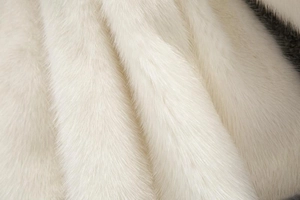 Close-up of premium white faux fur texture showing soft mink-like fibers and detail