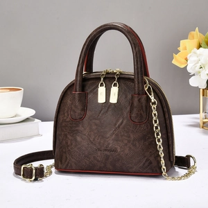 Deep brown pleated leather shell tote bag with red edge oil and golden chain strap