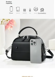 Detail showing high capacity of the black pebble leather shell bag with internal space view