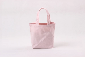 Detail view of pink canvas tote lunch bag showing thick durable fabric and sturdy handles
