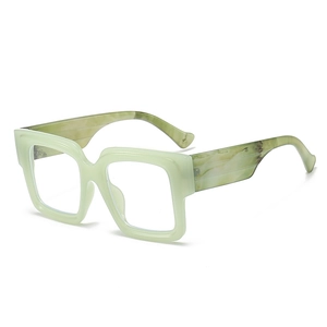 Stylish mint green oversized square blue light glasses with marble pattern temples