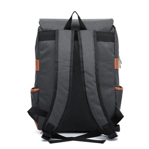 Rear view of grey canvas backpack with brown leather accents and black adjustable straps