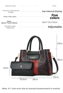 Detail view of red and black gradient crocodile pattern tote bag with adjustable strap
