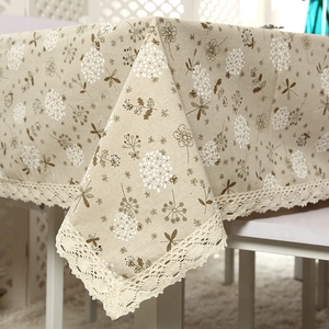 Linen texture tablecloth with white dandelion floral pattern and beige lace edge