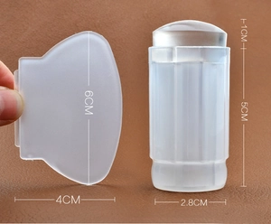 Detail of clear silicone nail stamper with size labels and translucent plastic scraper