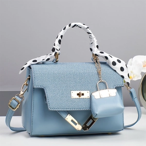 Light blue large capacity handbag with silk scarf handle and golden twist-lock closure