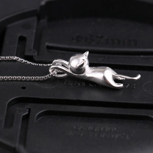 S925 Sterling Silver playful cat pendant necklace with a sleek box chain for women