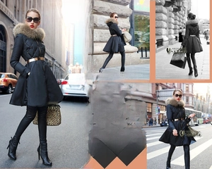 Polished gold metal belt detail styled on a slim black coat for a trendy look