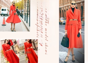 Detail of wide metallic gold mirror belt accenting a long red wool trench coat