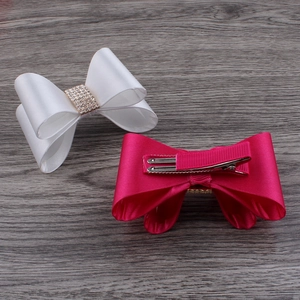 Detail showing chiffon rose flower hair clips for girls with rhinestone centers and metal clips