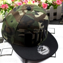 Detail view of camouflage snapback cap with 3D RUN embroidery and silver laser sticker