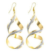 Macro detail of gold double-helix earrings featuring silver glitter textures on white background