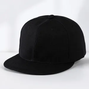 Detailed close-up of a plain black flat brim hip-hop cap with twill cotton texture