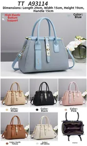 Detail showing the textured woven material and elegant metal lock on the shoulder bag