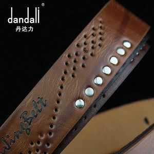 Detail of dark brown leather belt with metallic studs and breathable wave perforations