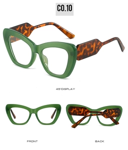 Detail view of cat eye glasses frames in dark green and brown tortoiseshell pattern