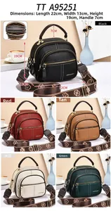 Detail view of stylish multi-pocket crossbody bag in various colors with printed strap