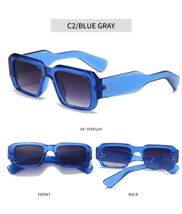 Detail view showing blue gray square frame sunglasses with rivets and metal hinges