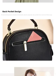Detail view of black litchi texture shoulder bag featuring secure back anti-theft zipper pocket