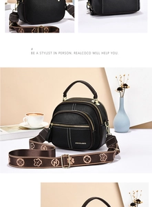 Close-up of black lychee grain leather bag with gold hardware and wide floral strap