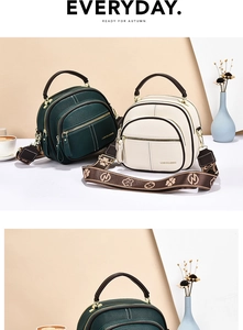 Close-up of pebble grain leather bags with jacquard straps and gold hardware