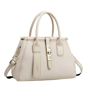 Minimalist cream white woven tote bag with adjustable shoulder strap and gold hardware