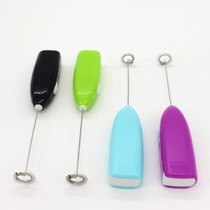 Macro view of four handheld electric milk frothers in black, green, blue and purple