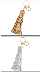 Detail view of leather tassels with gold and silver zinc alloy lobster clasps
