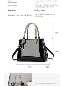 Black patent leather tote bag dimensions 29x13x21cm with snake pattern handle details