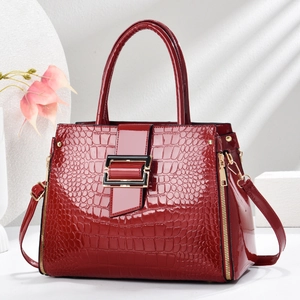 Luxurious dark red crocodile embossed patent leather handbag with gold-tone hardware detail