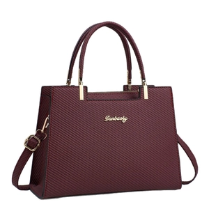 2025 Wine red large tote bag for women with trapezoid structure and gold hardware