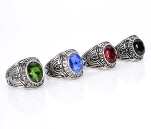 Detailed view of stainless steel US Army rings featuring red, blue, green and black gemstones