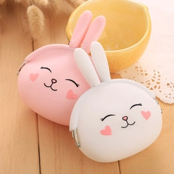 Detailed view of pink and white silicone rabbit coin purses with metal clasp closure