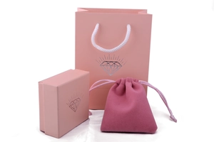 Pink jewelry packaging set including gift box, paper bag, and velvet drawstring pouch