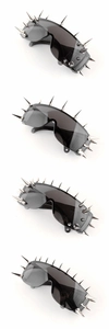 Close-up of four punk style sunglasses featuring black lenses and silver metallic spikes